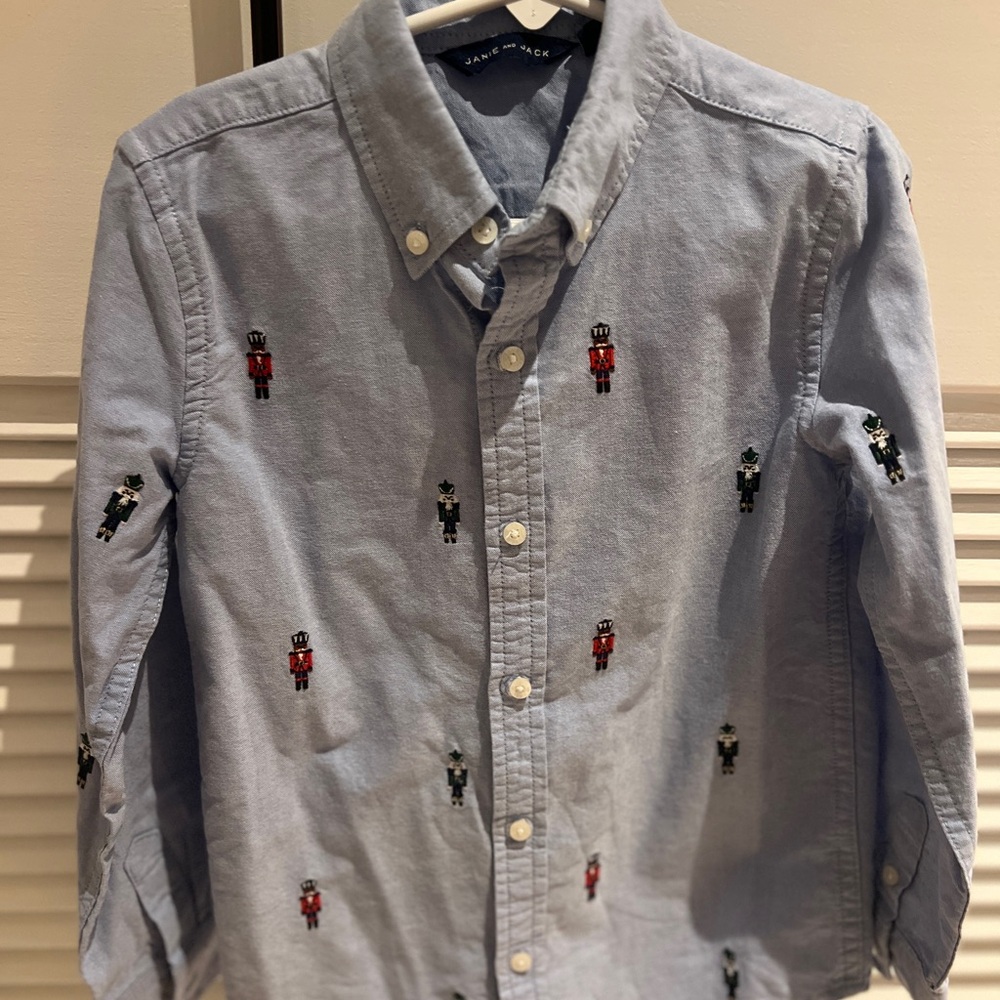 Janie and Jack dress shirt, like new. Nutcrackers on blue oxford shirt. Size 6.